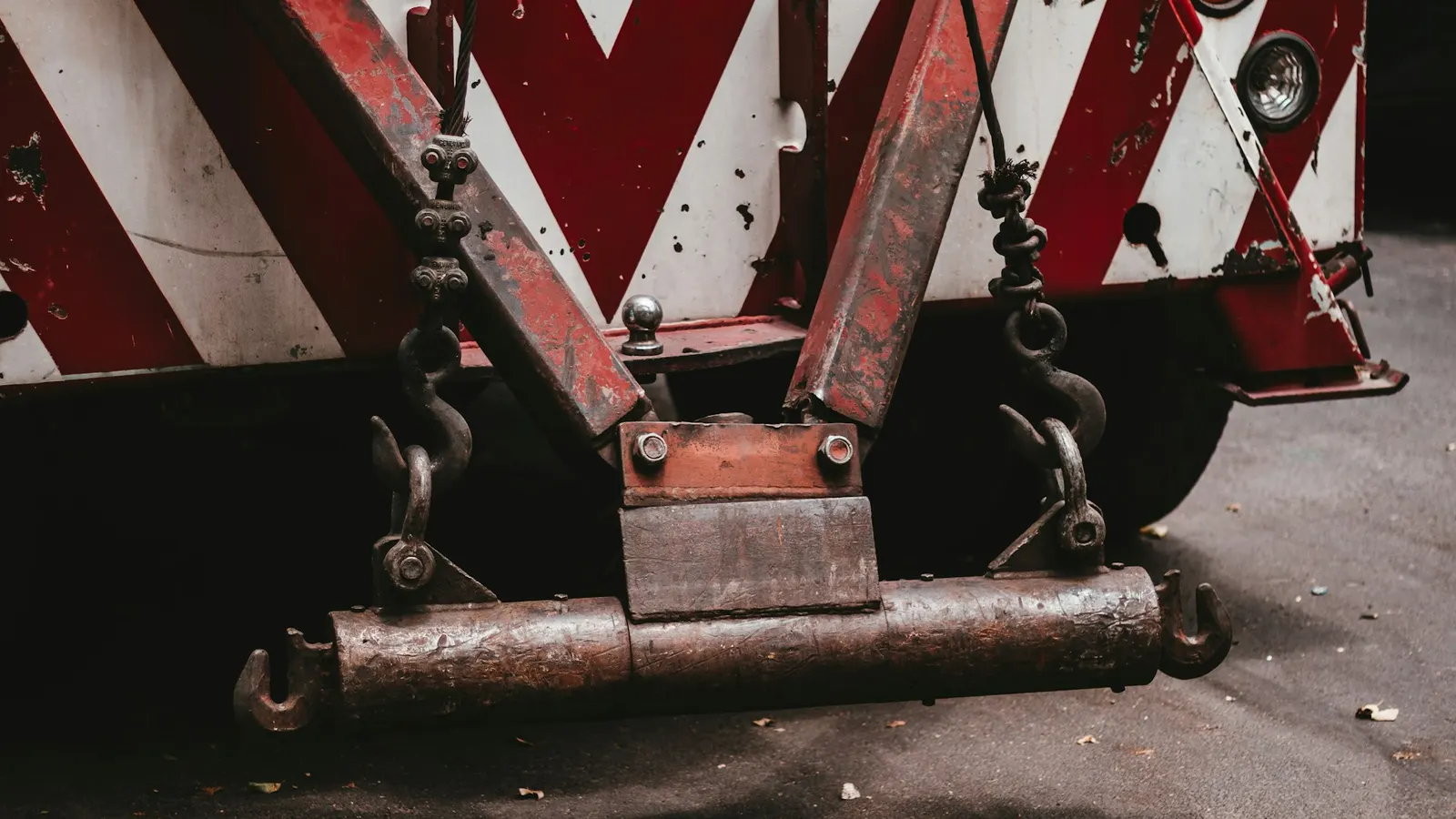 The boom and hooks on the back of a wrecker